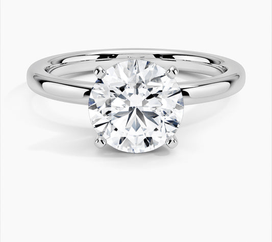 1.5 ct total weight round solitaire ring